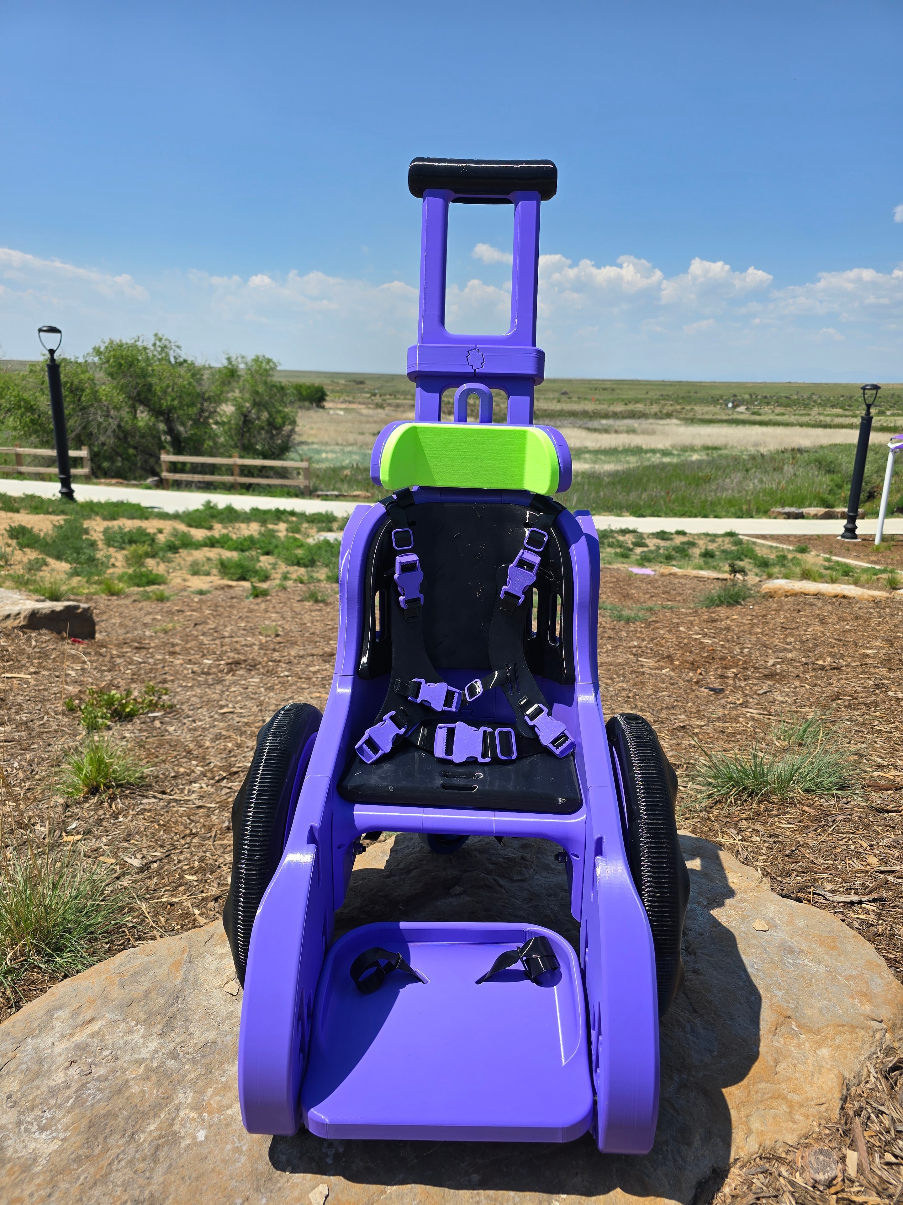Custom purple mobility device seat and harness view